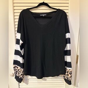 Darling waffle knot top with mixed sleeves.